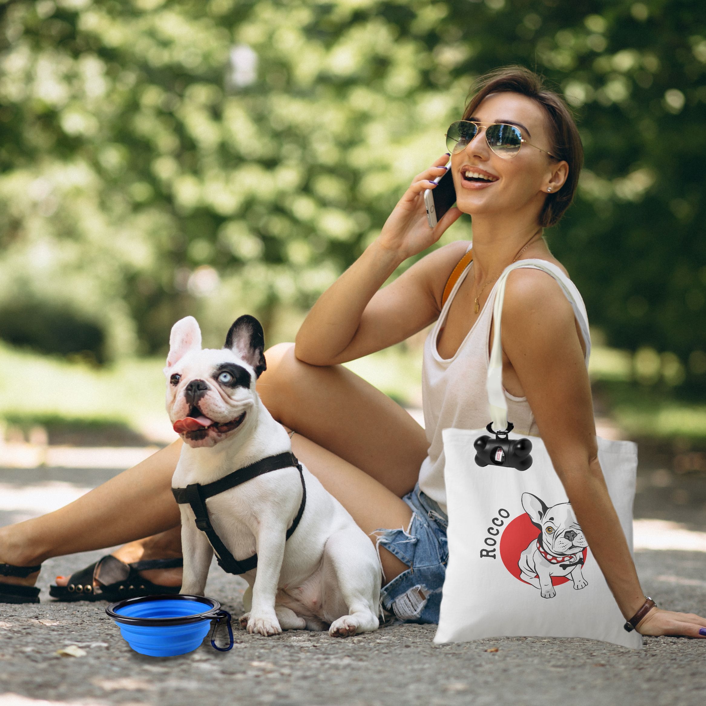 Woman with her pet french bulldog talking on the phone